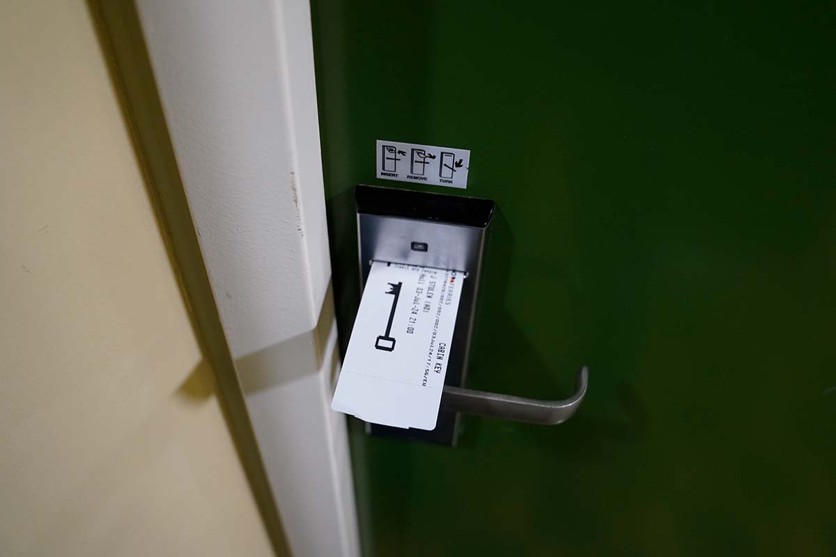 Door key in the lock of a green door